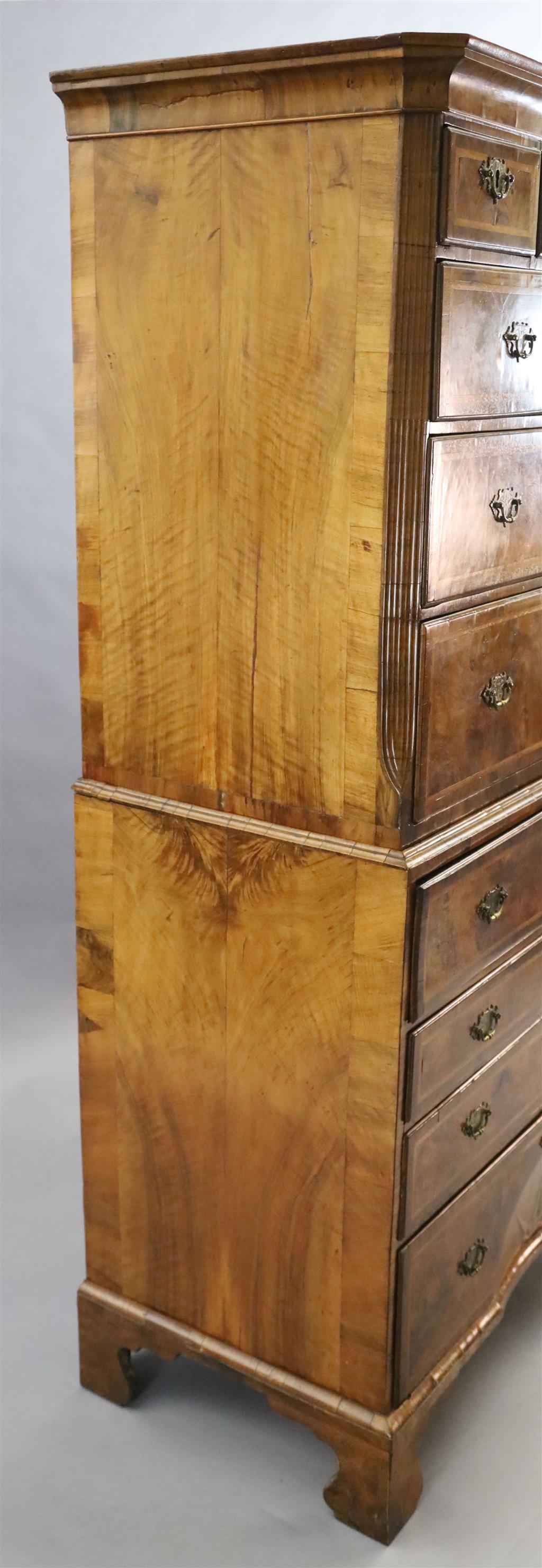 A George II figured walnut secretaire chest on chest, W.3ft 5.5in. D.1ft 10in. H.6ft 4in.